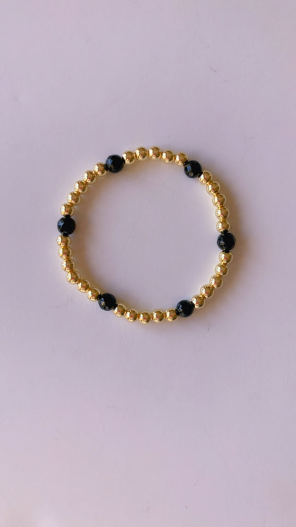 Gold filled and black gemstone bracelet