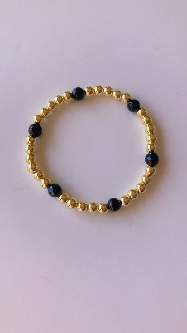 Gold filled and black gemstone bracelet